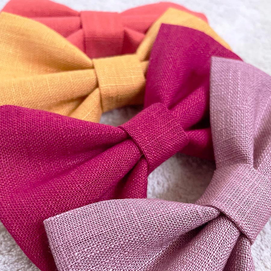 Linen dog bow ties in elderberry, mustard, wine red and orange